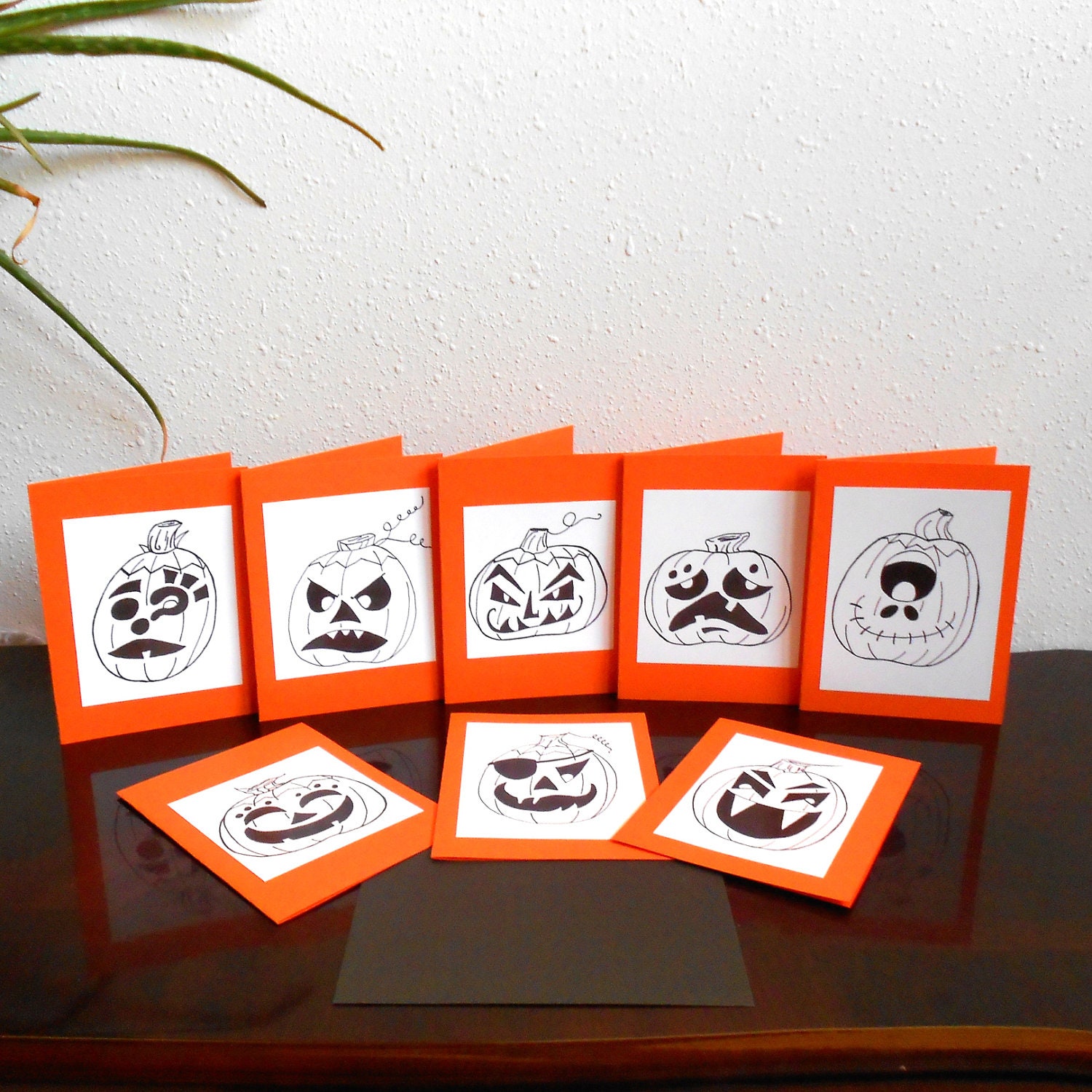 Halloween cards set of 8 jack o lanterns on orange background