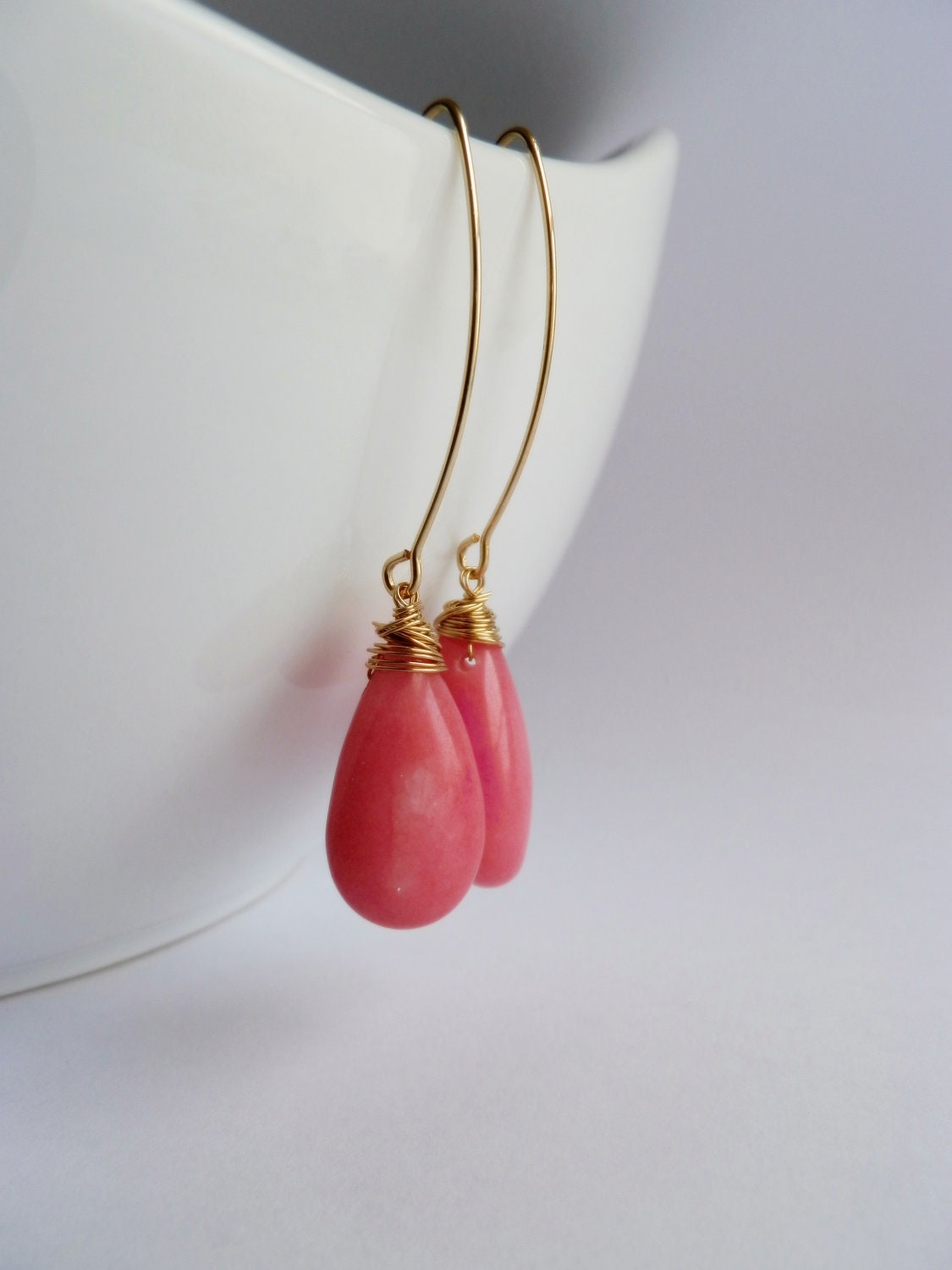Wire wrapped dangle jade stone goldfill earrings .