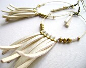 Somewhere - faux ivory leather and golden beads long earrings