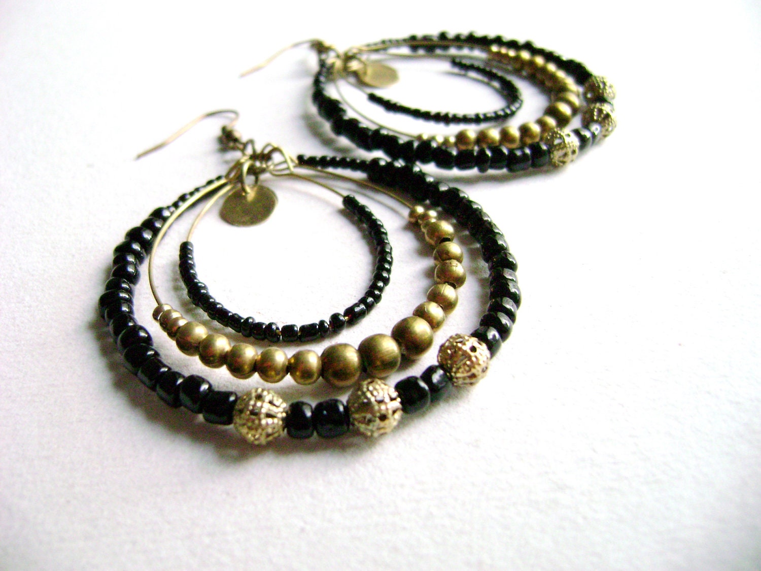 Sophistic - intense black and golden antique bronze long big earrings