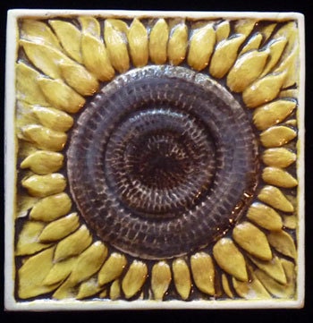 Decorative relief carved ceramic sunflower tile by earthsongtiles