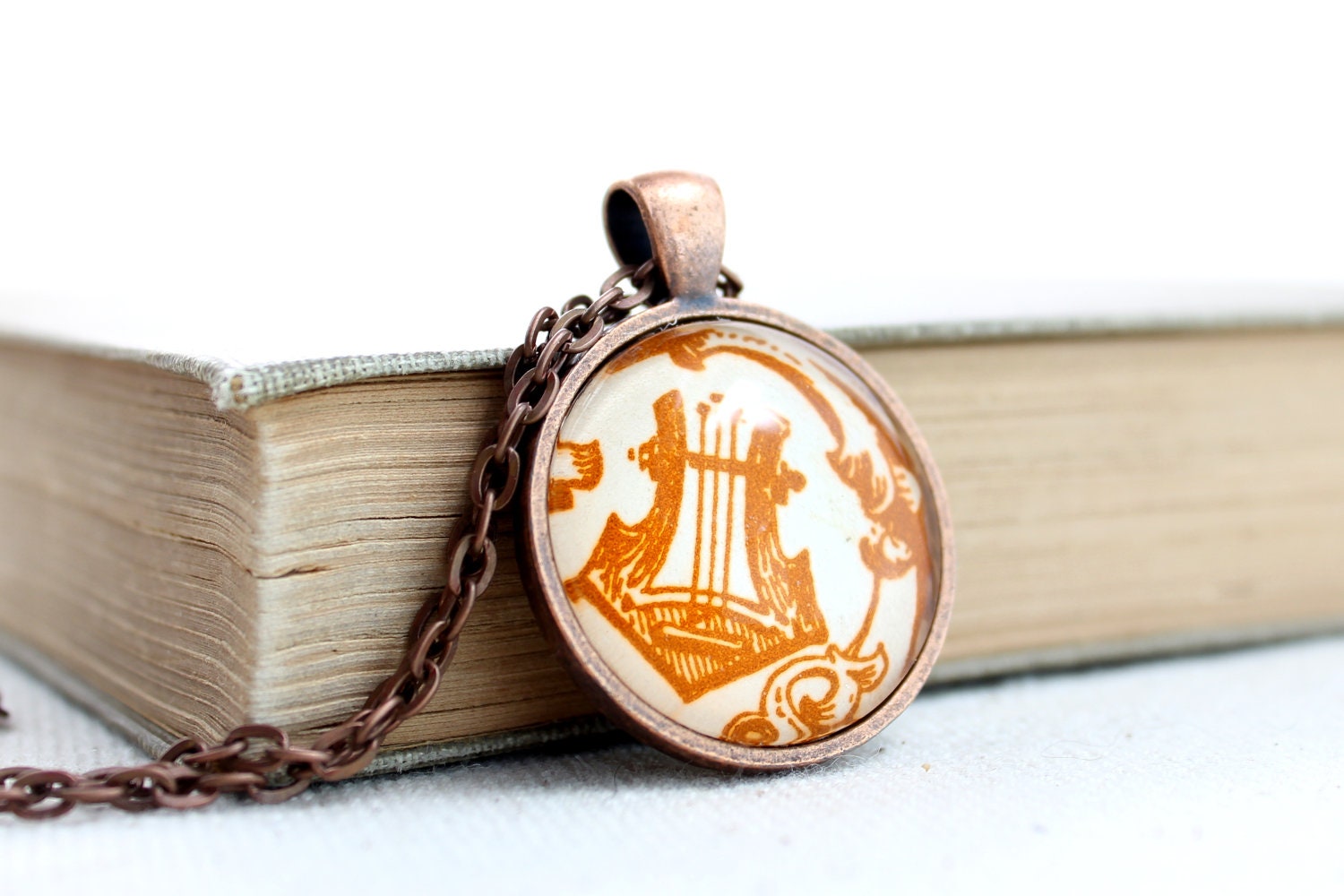 Lyre necklace harp jewelry made with vintage sheet music illustration in autumn colors glass and copper plated pendant