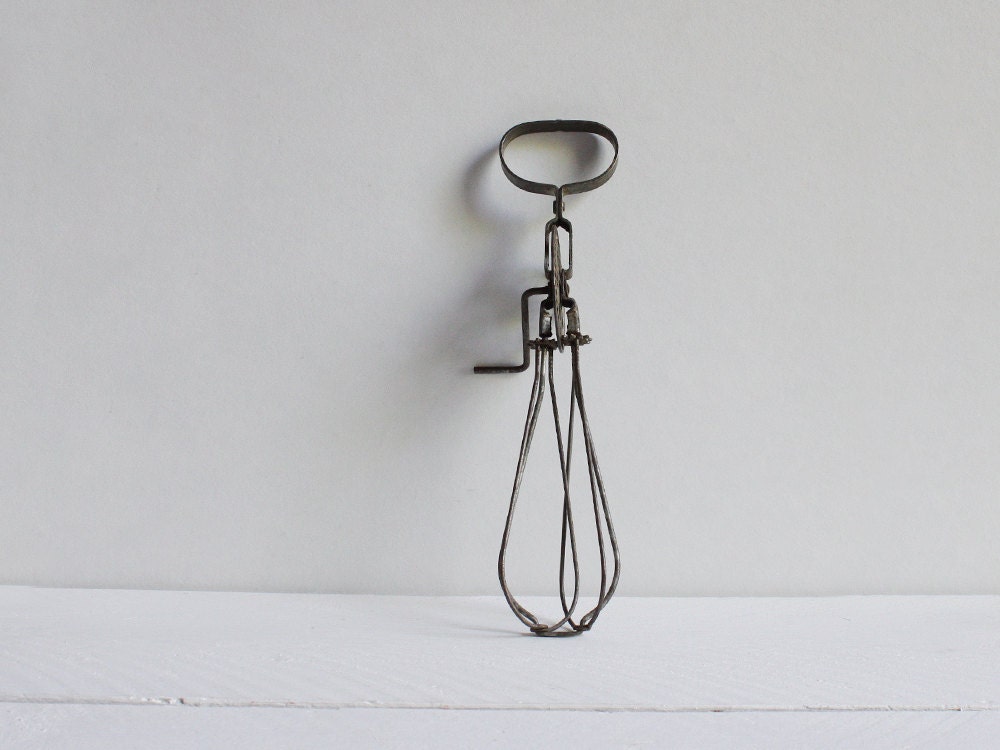 Vintage egg beater, An old rustic French kitchen whisk