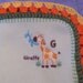 Adorable light green fleece blanket with embroidered giraffe and crocheted edge 33 x 43