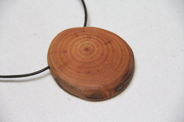 very cherry - tree branch slice on a leather cord