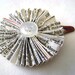 Paper flower hair clip made from vintage Bible pages with button