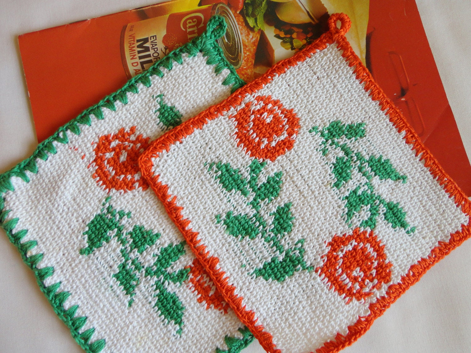 VINTAGE Pot Holders 1940s or 50s - pair of cream color crochet, orange flowers, green leaves orange and green edges square never used
