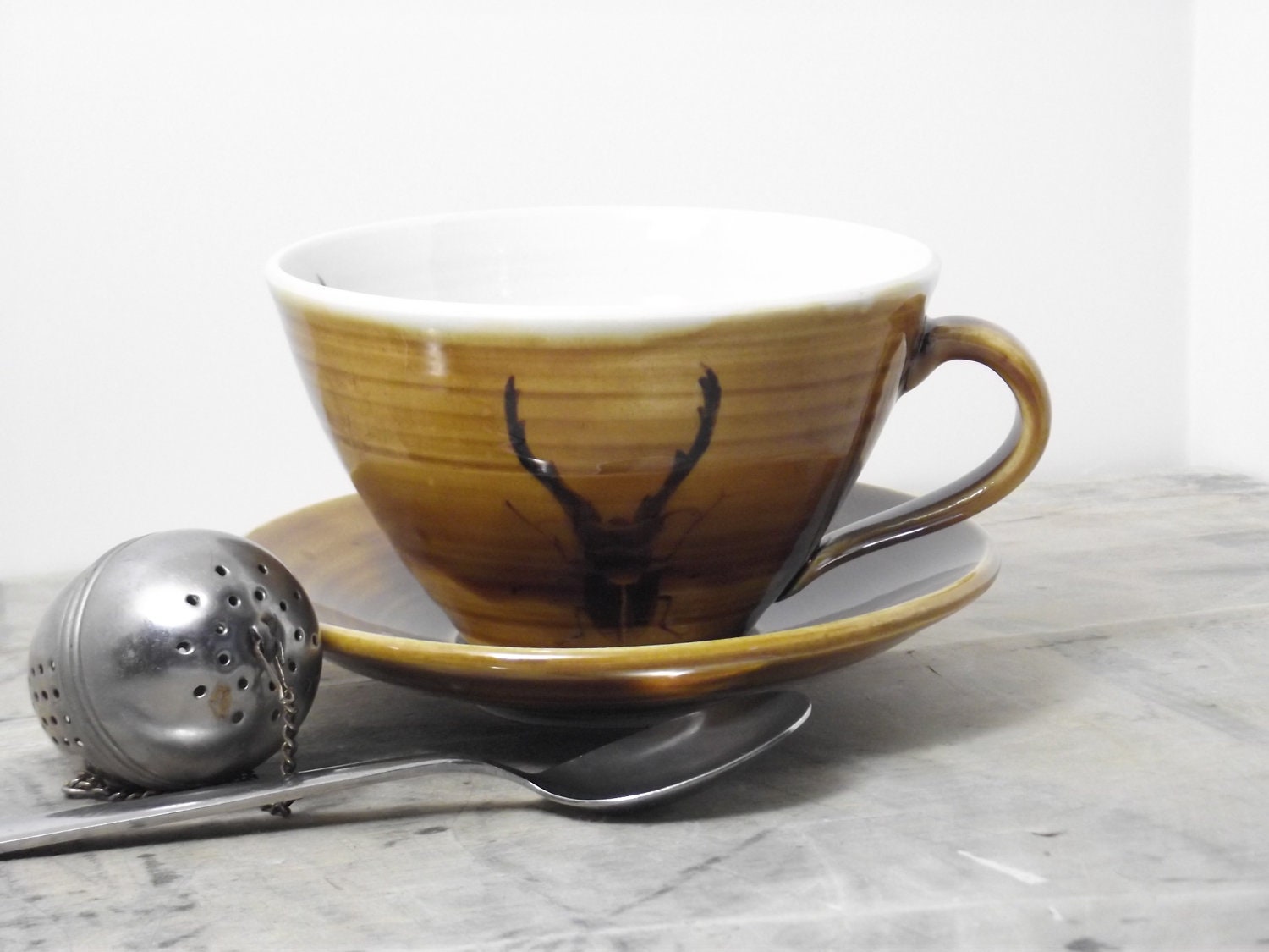 Porcelain Dark Amber Stag Beetle Tea Cup and Saucer