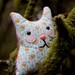 Josie - stuffed whimsy cat with floral pattern and sweet smile