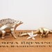 Reserved for Sue // vintage brass set of four dinosaur figurines