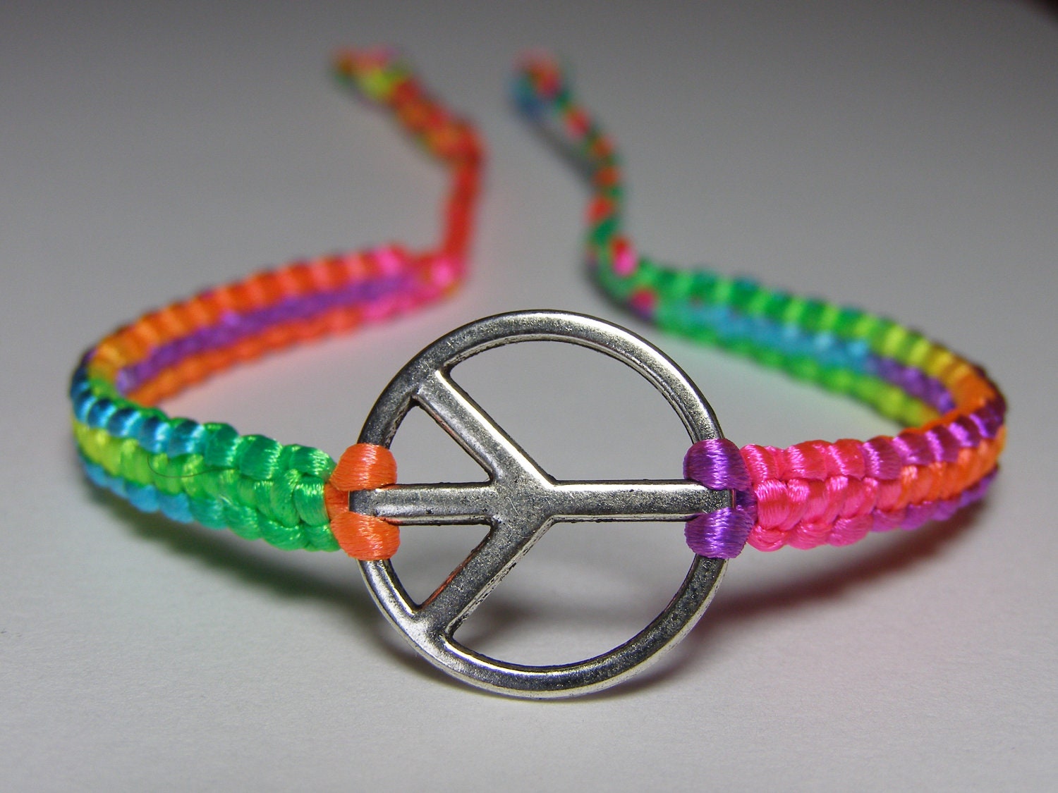 Peace Sign Bracelet with rainbow colored nylon thread