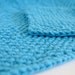 hand knit bright aqua blue cotton washcloth and bath scrubber set