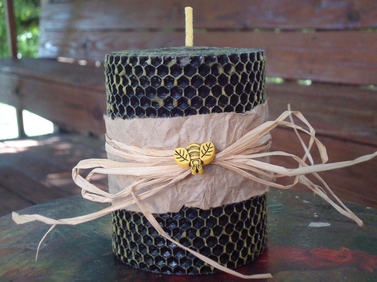 Two toned yellow and black hand rolled beeswax pillar candle