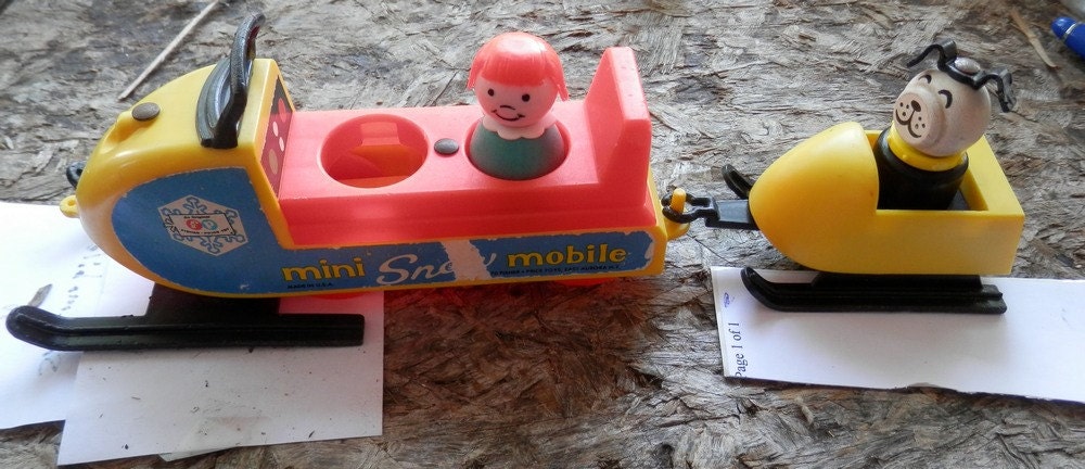 1971-73 Fisher Price 705 Mini Snow Mobile. with 2 figures with black optional skis and parts