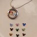 Glass locket necklace with Disney's Mickey Mouse Ears birthstone and Minnie (you choose the color) charm in round glass fillable pendant