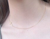 gold sideways cross necklace