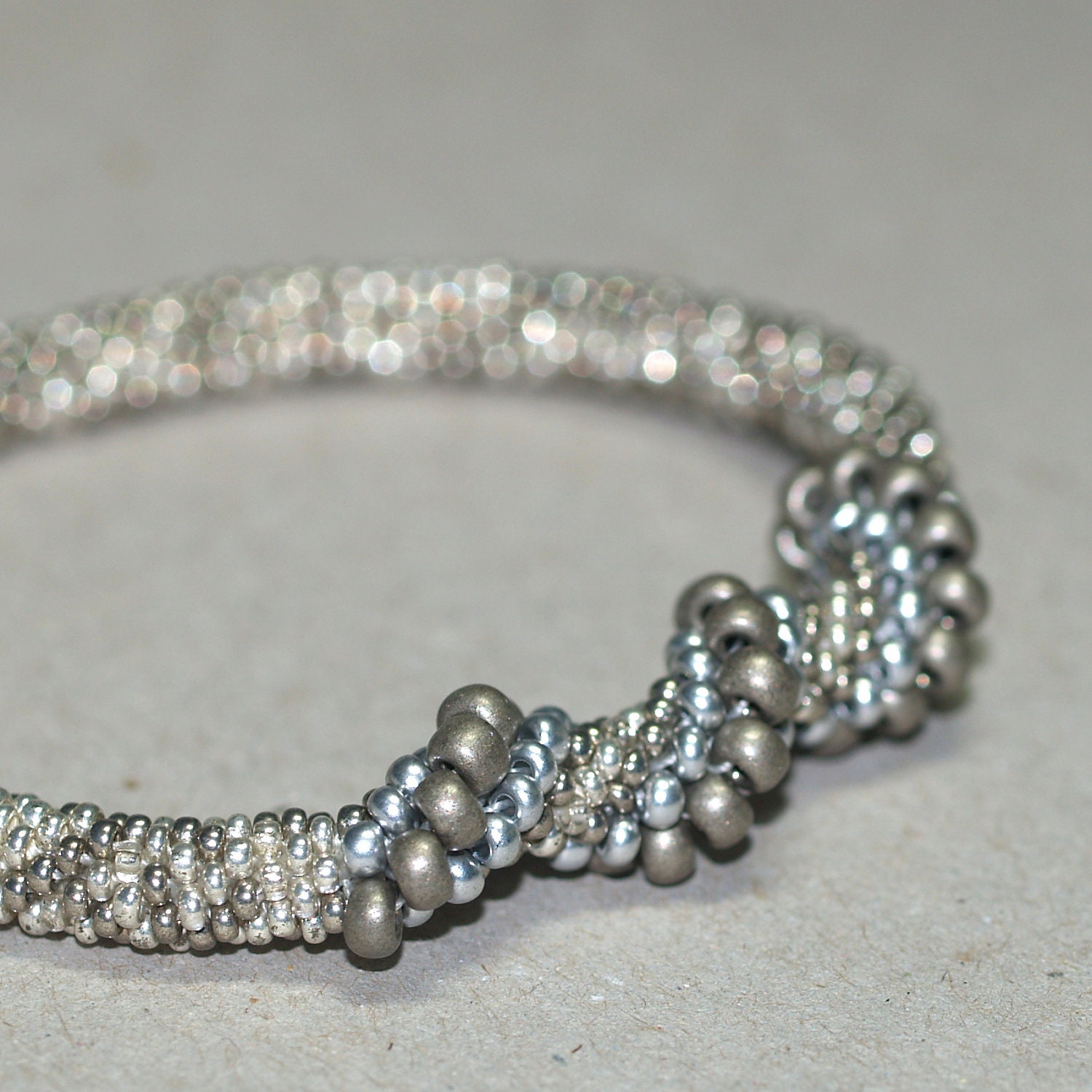 Silver Spiral ... Bangle Bracelet . Matte Silver . Shiny . Pewter . Stainless Steel . Bead Crochet . Spirals . Elegant . Handmade Jewellery