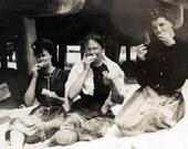 vintage photo 3 women eating sandwiches under the boardwalk at beach