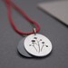 Seed Pods, a layered silhouette pendant