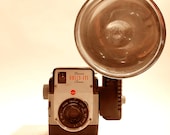 Vintage Kodak Brownie Bull's-Eye camera with flash attachment and flash bulb