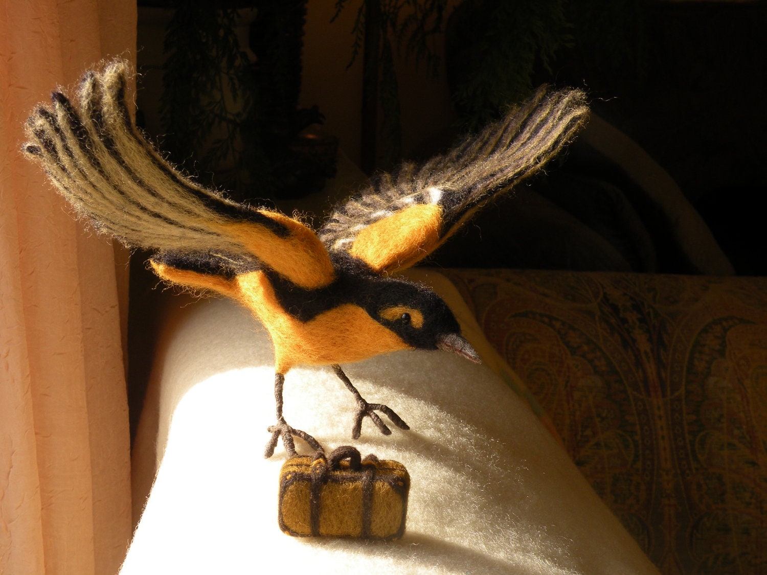 Needle felted bird...going south.
