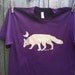 Arctic Fox on an Eggplant Unisex Adult Tee
