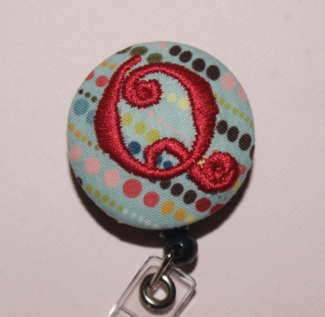 Id Reel monogrammed, U design, fabric, letter and color.