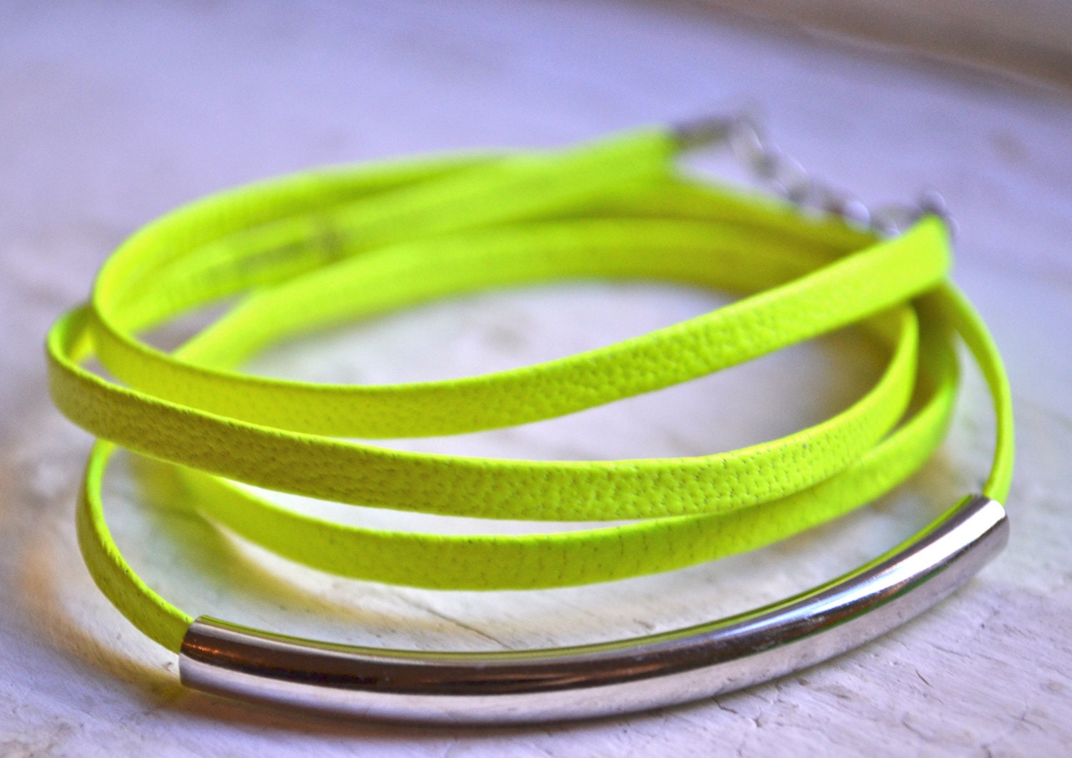 neon yellow skinny leather triple wrap bracelet with long silver tube
