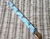 Turquoise and Grey Skull and Crossbones Universal Pacifier Clip