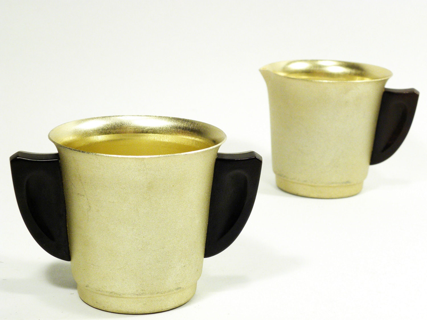 gold metal cream & sugar set . MIRRO the finest aluminum . great wing shape black celluloid handles . 1940s 1950s 1960s