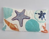 Beach themed pillow cover in off white with sea creatures 12X18 inch.