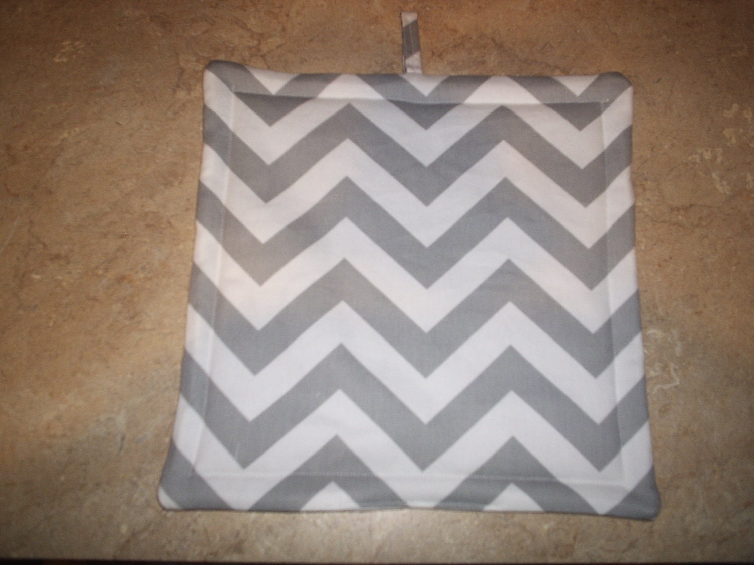 Set of 2 Potholders in Gray and White Chevron fabric.