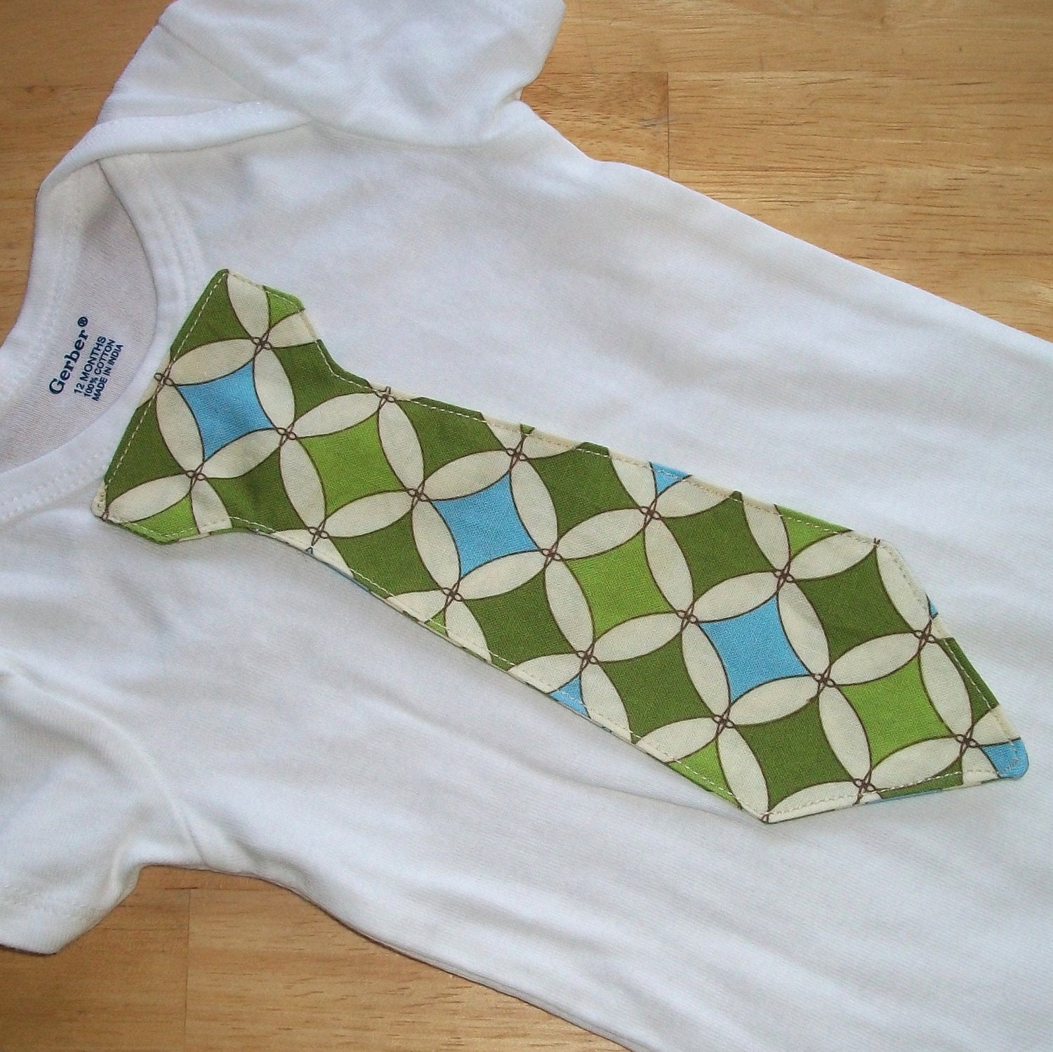 Tie onesie or T-shirt, green and aqua blue diamond pattern. Fabulous choice for St. Patrick's Day and great spring colors.