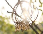 SHOE FETISH - multiple, stackable wire bangles with golden shoes, boots, pumps charms...  on black cherry pearl bracelets