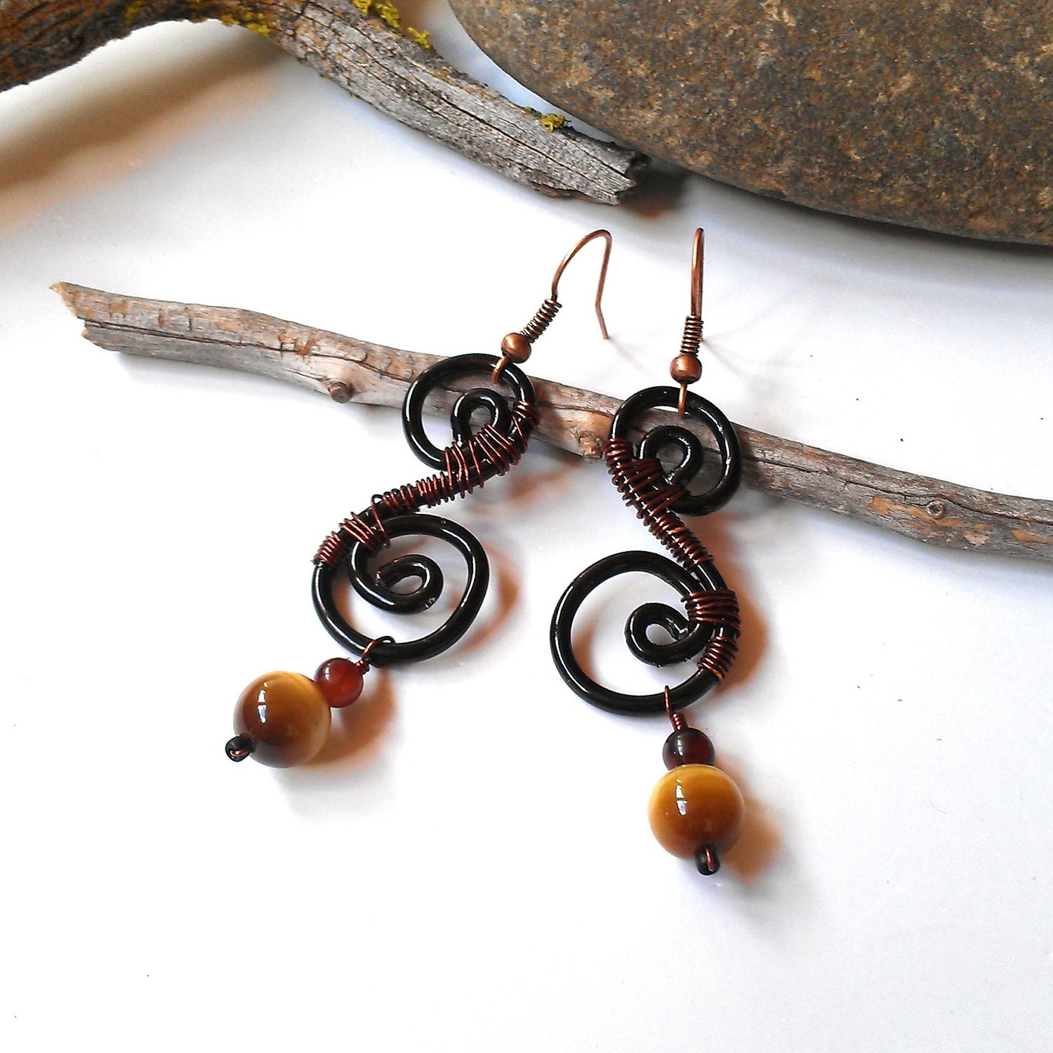 Wire wrapped earrings black and brown spirals with red and yellow tigers eye beads