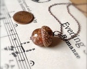 Mini Glass Acorn Necklace - Pale Pink Goldstone Sparkle with Vintage Metal Leaf by Bullseyebeads