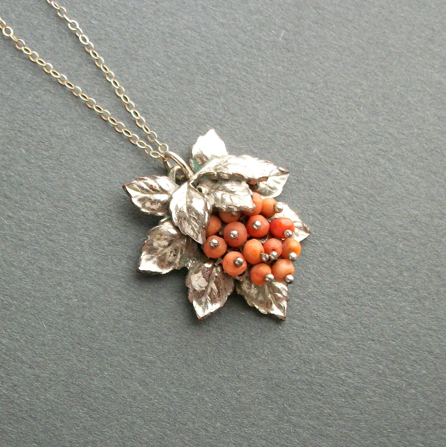 1930s Coral Currants Pendant with Rhodium Leaves.