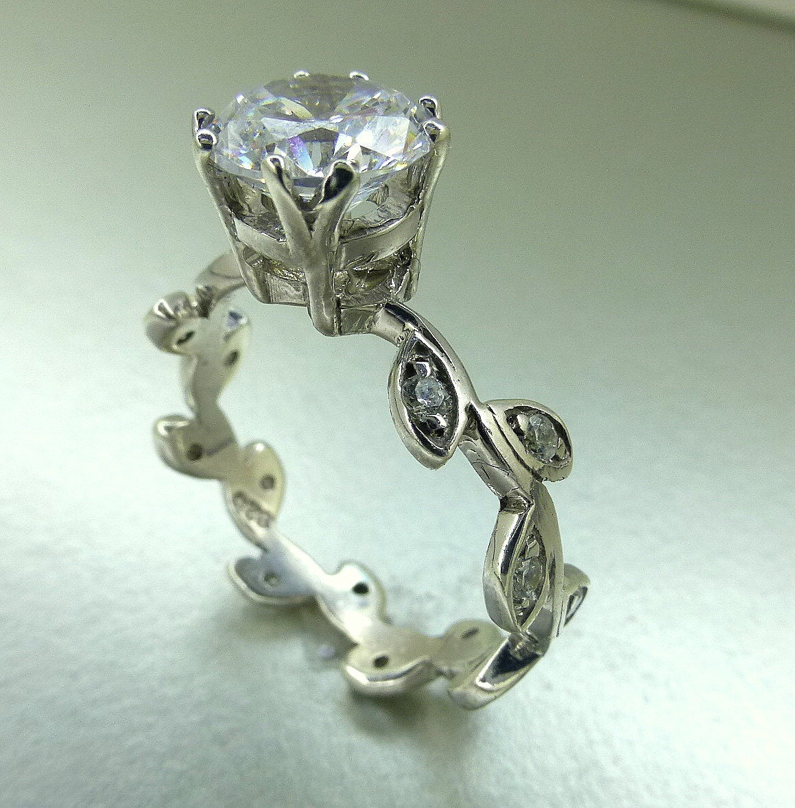 Leaf engagement ring. Moissanite center stone.