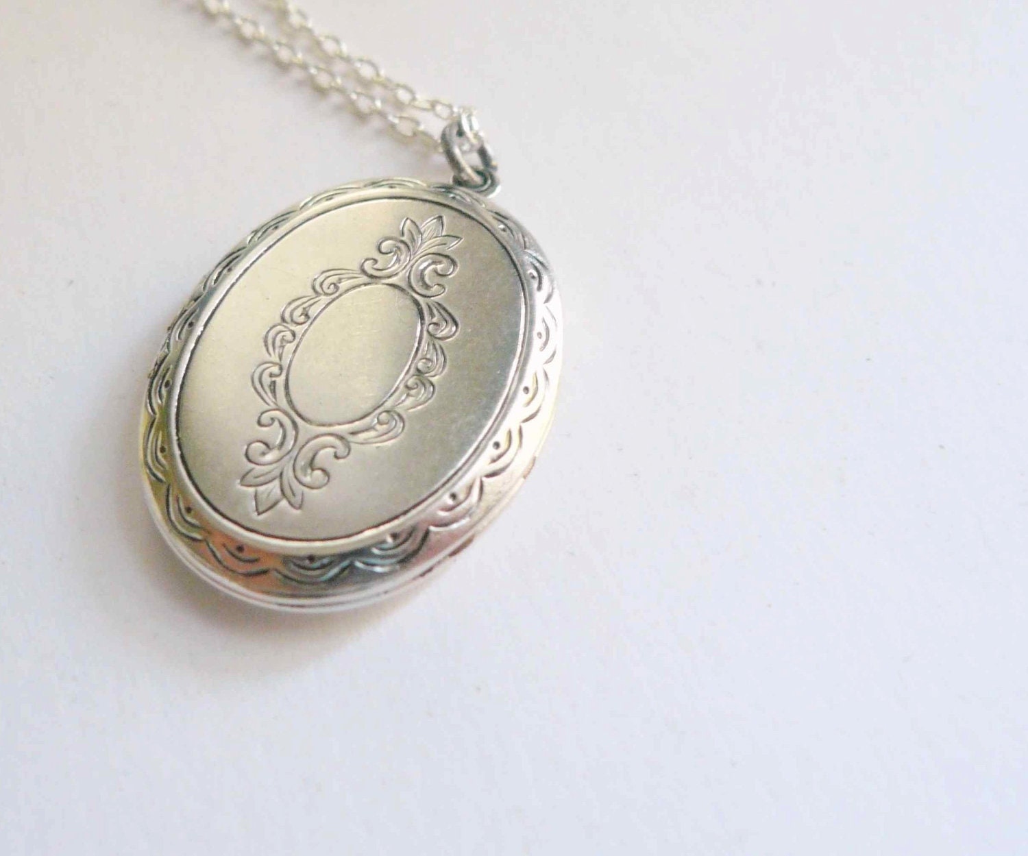 Silver locket necklace with victorian embossed detail on sterling silver chain