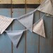 Classic Bunting. Colours -  Pastel Blue, Pale Blue and White. Fabric Patterns - Spots, Roses and Stripes..