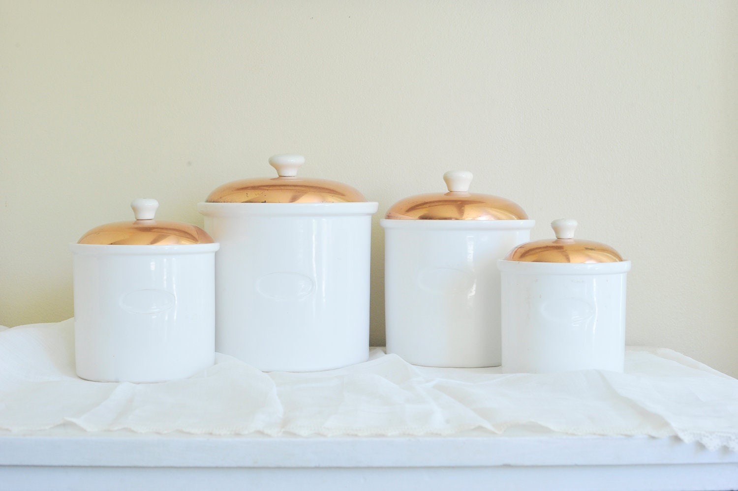 Set of Four Vintage Ceramic Canisters with Copper Lids and Ceramic Knobs