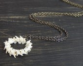 Ouroboros (dead) Circle of snake vertebra necklace.