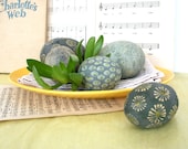 Group of five hand painted ceramic spheres with daisies and dots. 45