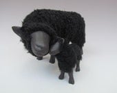 Black Sheep Snuggling with Lamb