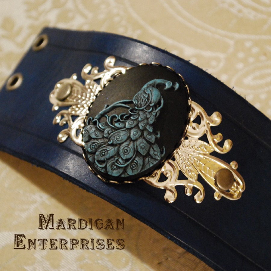 Leather Cuff - Black and Blue Peacock Cameo on blue leather