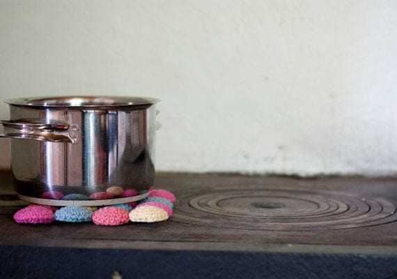 Eco cotton and wood trivet in pastels. Crocheted circles in pink, peach, yellow and blue. Eco friendly.