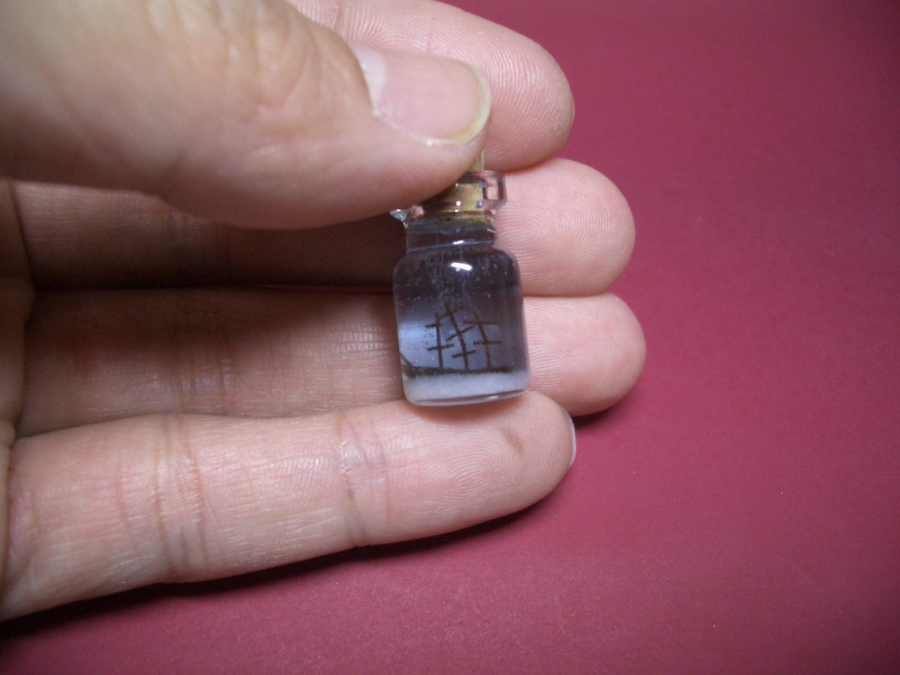 An unidentified sunken vessel in a tiny bottle  -Bottle ship-