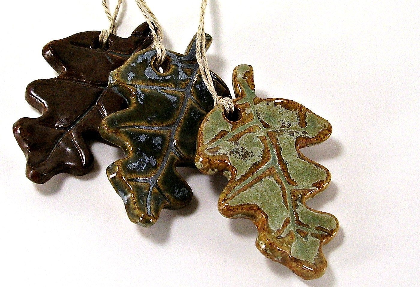three ceramic leaf ornaments christmas ornaments gift tags home decor rustic green pine green winter brown handmade stoneware pottery