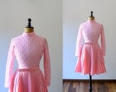 Vintage 1960s pink belted mini dress with pleated skirt