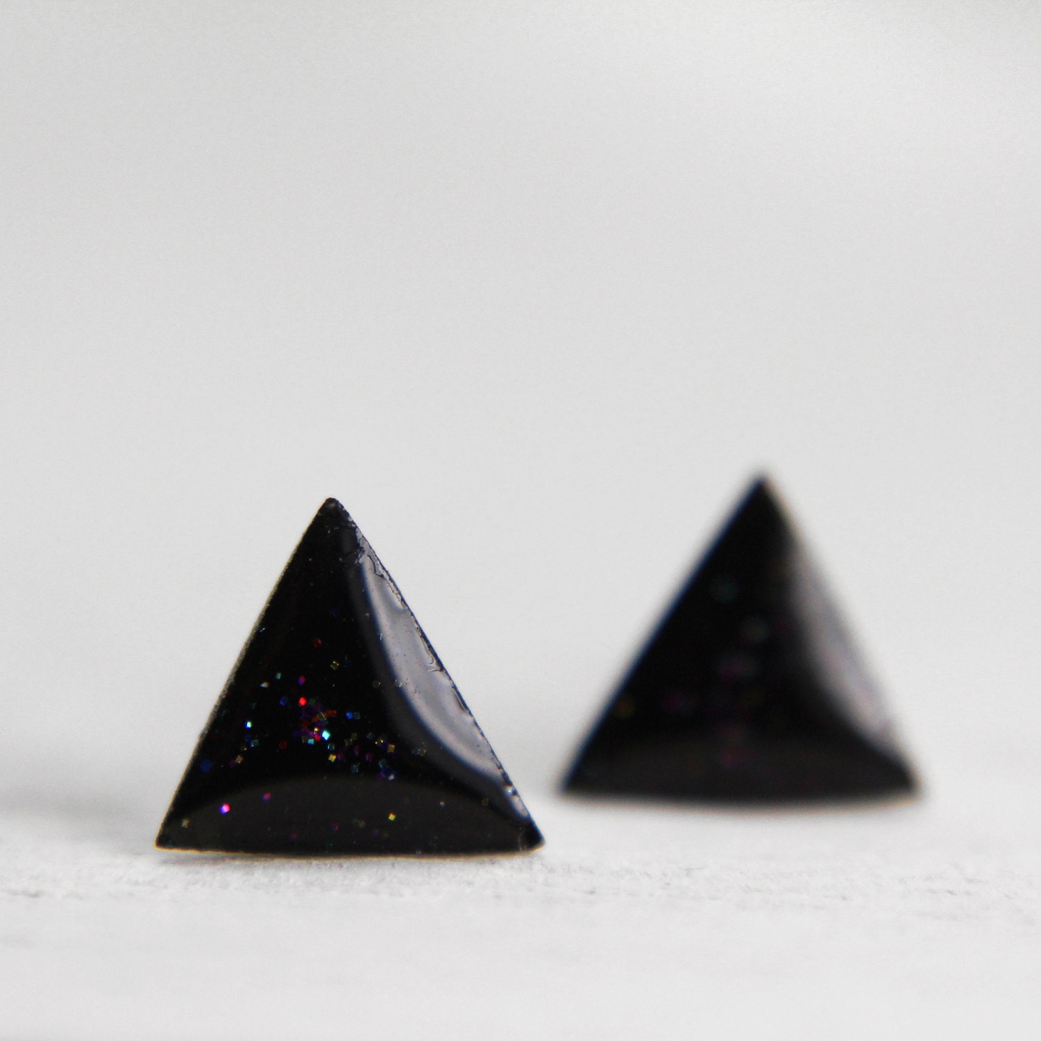 tiny triangle earrings in sparkly rainbow black stud earrings geometric posts